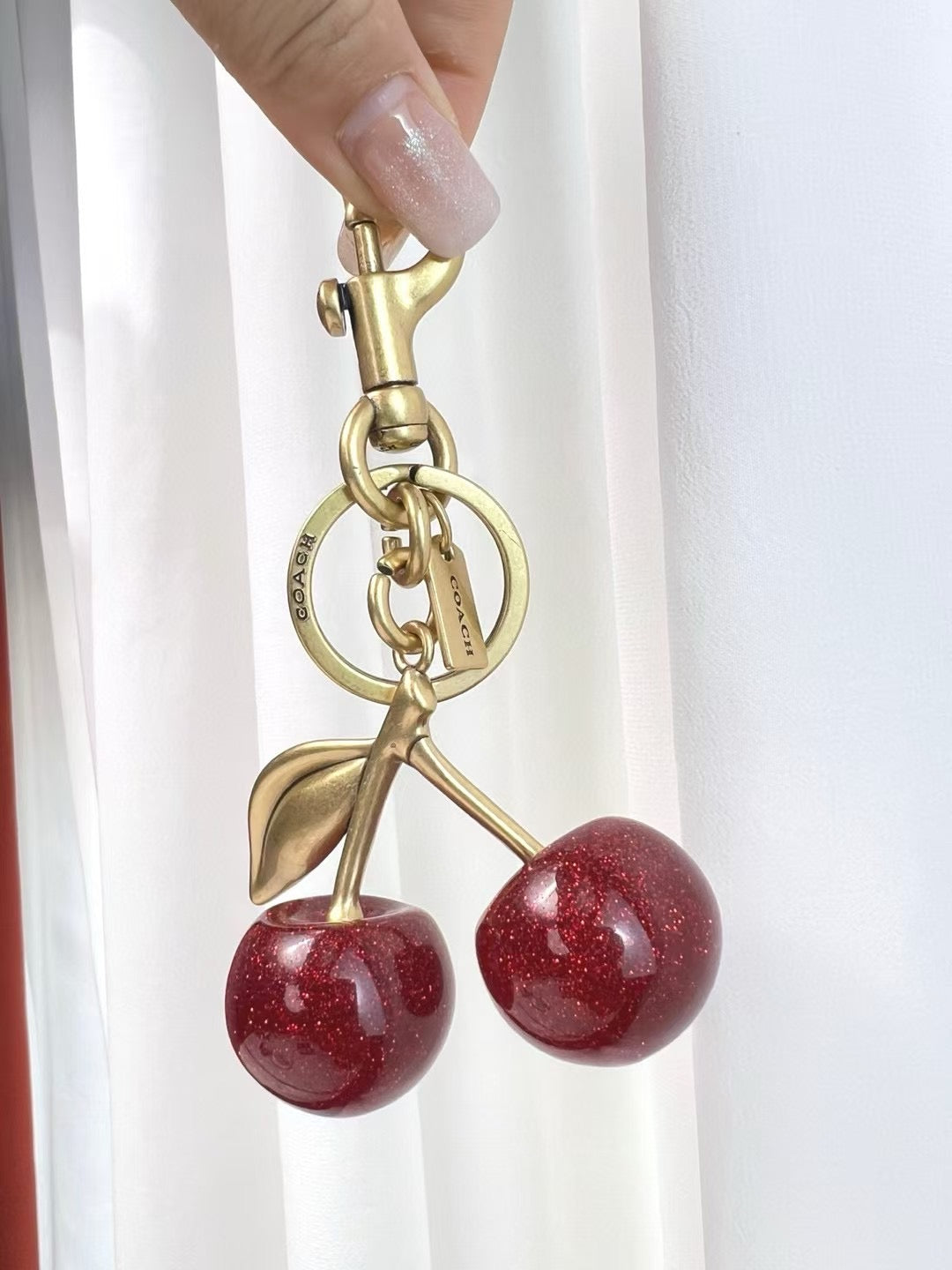 Coach cherry charm